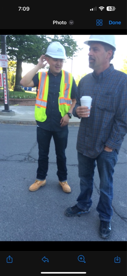 Kyle on a job site in a hard hat and hi-vis vest, during his construction years